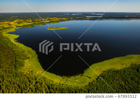 Top view of lake Drivyaty in the Braslav lakes National Park, the most beautiful lakes in Belarus.An island in the lake.Belarus. 67893312