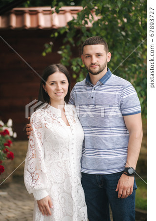 Beautiful young woman with her husband outdoors 67893727