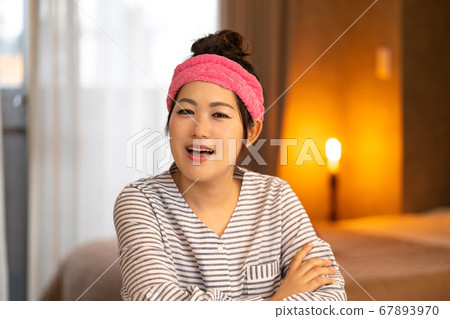 Young housewife having a hair turban Young housewife having a hair turban 67893970