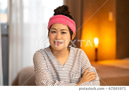 Young housewife having a hair turban Young housewife having a hair turban 67893971
