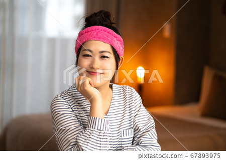 Young housewife having a hair turban Young housewife having a hair turban 67893975