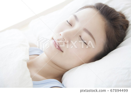 woman sleeping in bed woman sleeping in bed 67894499