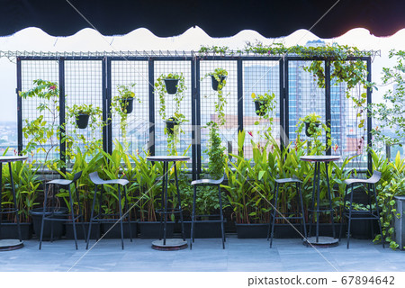 Table and chair on the terrace 67894642