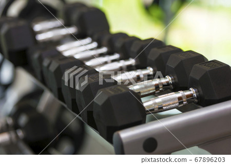 Close up view of dumbbells on the rack Close up view of dumbbells on the rack 67896203