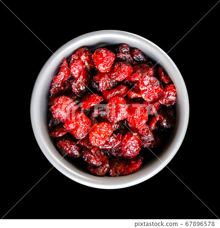 Cranberries in a bowl isolated on black background Cranberries in a bowl isolated on black background 67896578