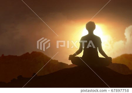 Silhouette of a pregnant woman is practicing yoga Silhouette of a pregnant woman is practicing yoga 67897758