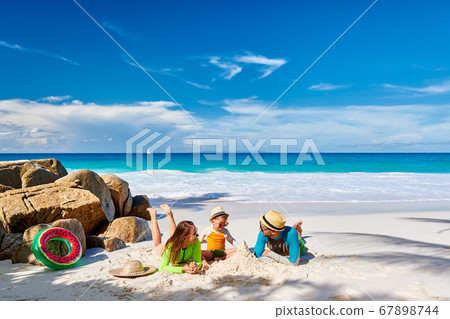 Family with three year old boy on beach Family with three year old boy on beach 67898744