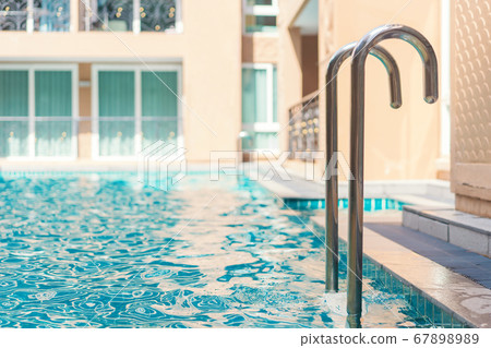 blue swimming pool at hotel with stair 67898989