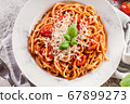 Spaghetti Napoli with parmesan cheese 67899273