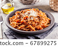 Spaghetti bolognese with mushrooms and cheese. 67899275