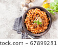 Spaghetti bolognese with mushrooms and cheese. 67899281
