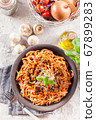 Spaghetti bolognese with mushrooms and cheese. 67899283