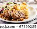 Braised pork loins with onion sauce 67899285