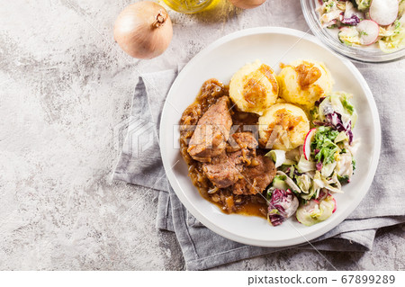 Braised pork loins with onion sauce Braised pork loins with onion sauce 67899289