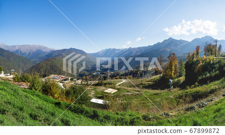 Large panorama view of Rosa Khutor ski resort, year-round mountain resort near Sochi, Russia. 67899872