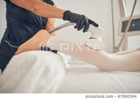 Using special device for reducing fat on legs Using special device for reducing fat on legs 67900304