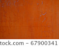 Abstract strong red-orange color interior on the concrete walls, some scratch on the wall 67900341