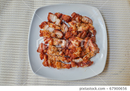 fried pork belly on white dish. top view, Traditional Roasted streaky pork 67900656