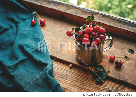 Ripe cherries in mug. Good Morning Concept Rustic, vintage Selective focus 67902333