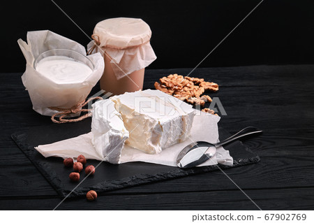 Assorted dairy products milk, yogurt, cottage cheese, sour cream. Rustic still life. Farmer's cow dairy products. 67902769