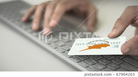 Man pays online with credit card with printed flag of Cyprus. Fictional numbers Man pays online with credit card with printed flag of Cyprus. Fictional numbers 67904203