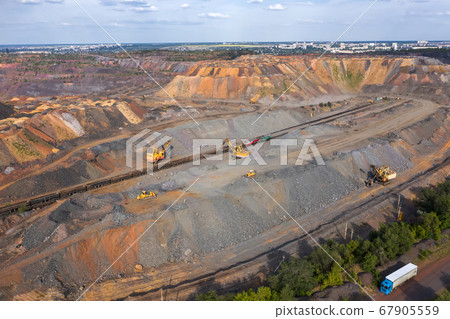 Industrial of opencast mining quarry with lots of machinery at work aerial view. 67905559