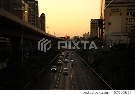 Golden hour shining over Bangkok City in Thailand during the sunset giving it a cinematic and moody theme 67905655