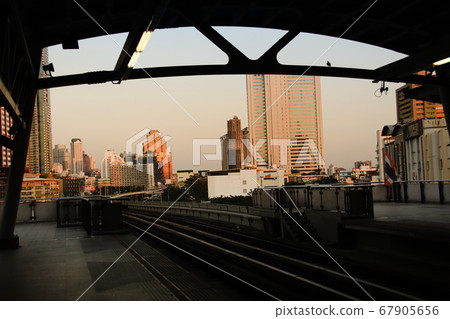 Golden hour shining over Bangkok City in Thailand during the sunset giving it a cinematic and moody theme 67905656