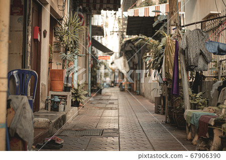 Empty deserted alleyways of Chinatown (Yaowarat Road) in Bangkok, Thailand during the lock down and home quarantine due to the covid-19 pandemic showing the new normal life 67906390