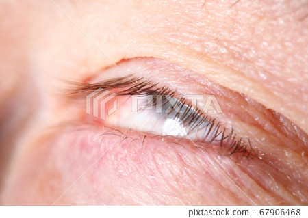 Male eyelashes extreme close-up with eyes rolled 67906468