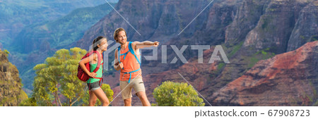 Hiking couple looking in mountain nature banner Hiking couple looking in mountain nature banner 67908723