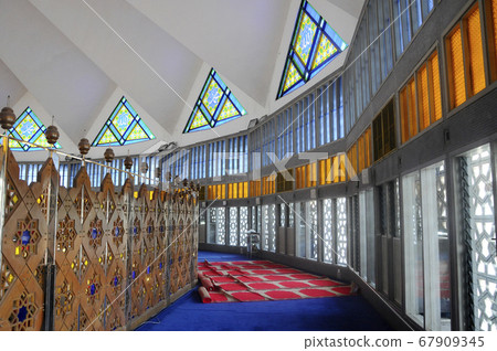 KUALA LUMPUR, MALAYSIA -JANUARY 05, 2015: Interior of National Mosque of Malaysia or  Masjid Negara. The mosque located in Kuala Lumpur, Malaysia. Built in 1965 and has a capacity of 15,000 people.  67909345