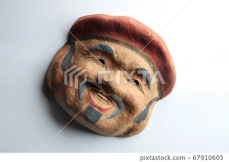 An old man's mask made of paper clay 67910605