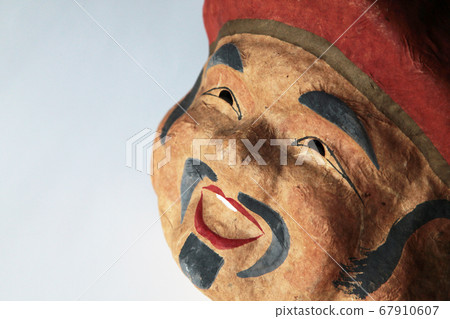 An old man's mask made of paper clay 67910607