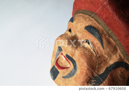 An old man's mask made of paper clay An old man's mask made of paper clay 67910608