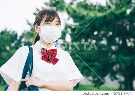 High school students wearing masks to attend school 67914764