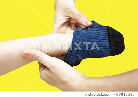 Mom's Hand Wearing Socks 67915353