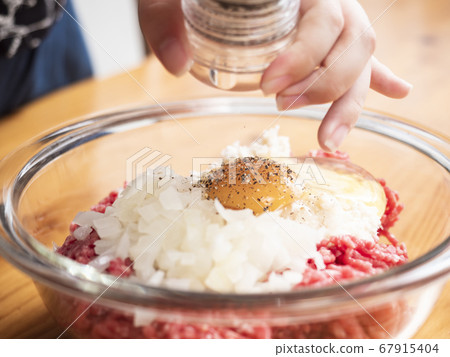 Handmade hamburger seeds ground pepper in a mill 67915404