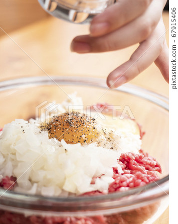 Handmade hamburger seeds ground pepper in a mill 67915406