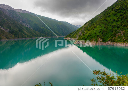 Beautiful mountain turquoise color lake Karasuu. Kyrgyzstan. Beautiful mountain turquoise color lake Karasuu. Kyrgyzstan. 67918082