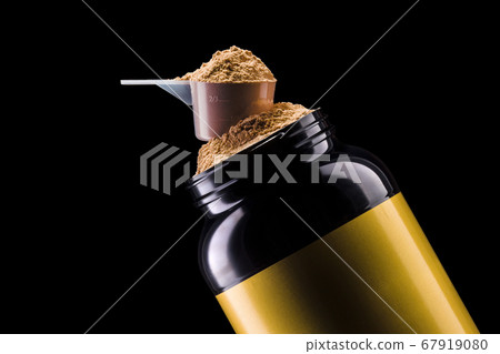 A scoop of chocolate protein powder drink in black plastic container isolated A scoop of chocolate protein powder drink in black plastic container isolated 67919080