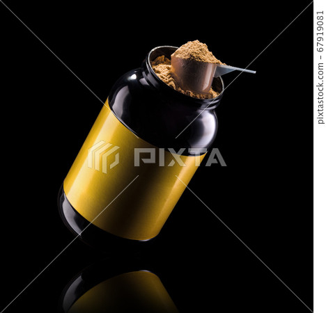 A scoop of chocolate protein powder drink in black plastic container isolated A scoop of chocolate protein powder drink in black plastic container isolated 67919081