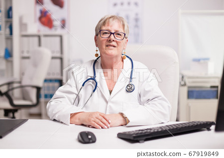 Senior medical practitioner with stethoscope Senior medical practitioner with stethoscope 67919849