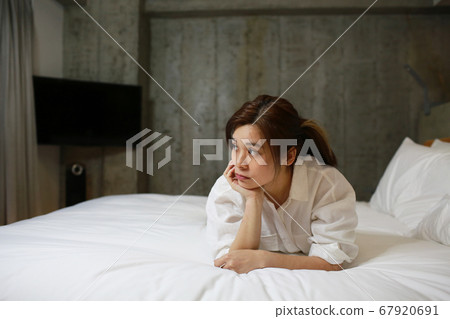 woman work from home on the bed woman work from home on the bed 67920691