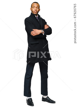 full length studio shot of a african-american businessman wearing coat Isolated on white background full length studio shot of a african-american businessman wearing coat Isolated on white background 67920765