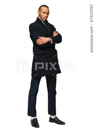 full length studio shot of a african-american businessman wearing coat Isolated on white background full length studio shot of a african-american businessman wearing coat Isolated on white background 67920767