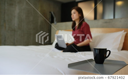 woman work from home on the bed woman work from home on the bed 67921402