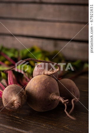 Beet with green tops close-up Beet with green tops close-up 67921631