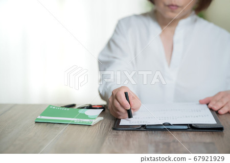 Woman stamping a contract 67921929