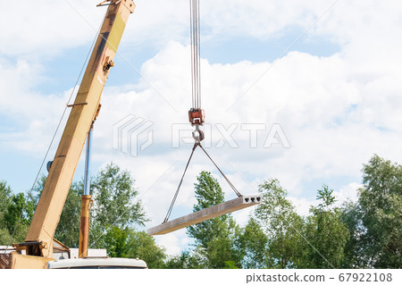 Builder worker installing concrete floor slab 67922108